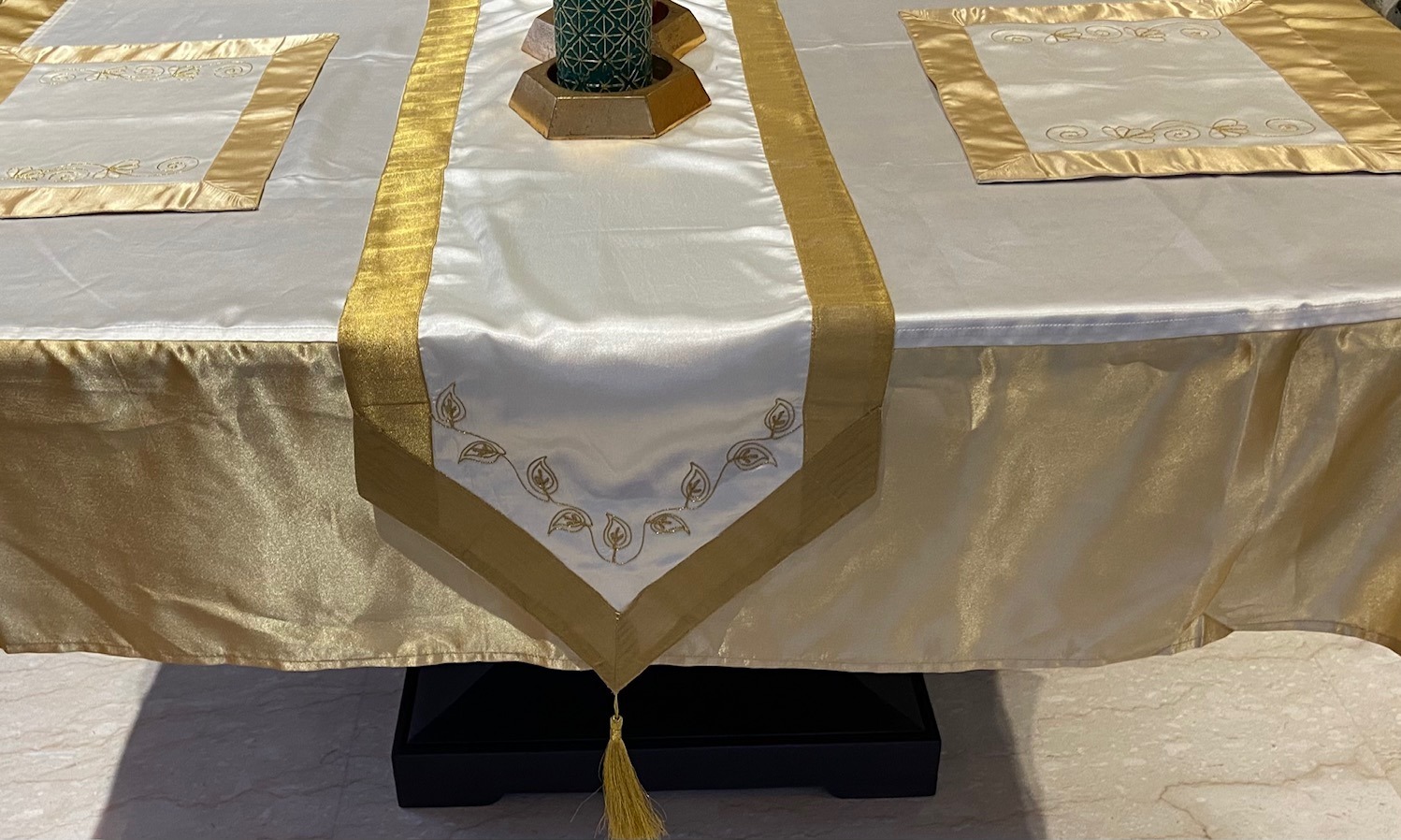 Cream and gold embroidered table linen